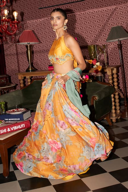 Shop Rishi and Vibhuti Yellow Crepe Embroidery, Pom-poms Halter Neck Boho Bloom Print Skirt Set Online at Aza Fashions Shop_Rishi and Vibhuti_Yellow Crepe Embroidery, Pom-poms Halter Neck Boho Bloom Print Skirt Set _Online_at_Aza_Fashions