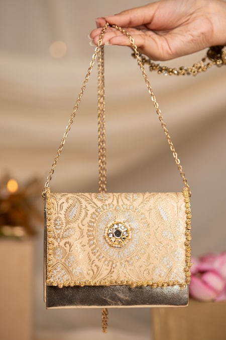 Shop 5elements Peach Beads, Pearls, Mirrors Aarna Brocade Paisley Motif Clutch Bag With Sling Online at Aza Fashions Shop_5elements_Peach Beads, Pearls, Mirrors Aarna Brocade Paisley Motif Clutch Bag With Sling _Online_at_Aza_Fashions