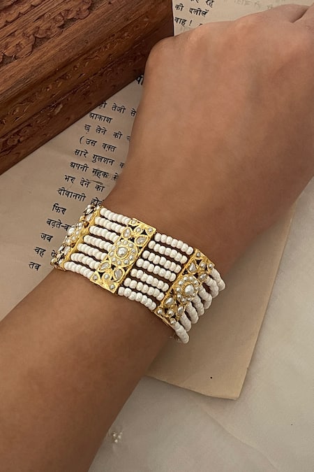 Saga Jewels White Pearls, Stones Embellished Bracelet Online at Aza Fashions Saga Jewels_White Pearls, Stones Embellished Bracelet _Online_at_Aza_Fashions