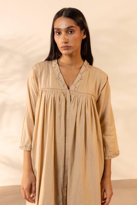 Shop OurDve Beige Cotton Embroidery, Piping V-neck Floret Gathered Dress Online at Aza Fashions Shop_OurDve_Beige Cotton Embroidery, Piping V-neck Floret Gathered Dress _Online_at_Aza_Fashions
