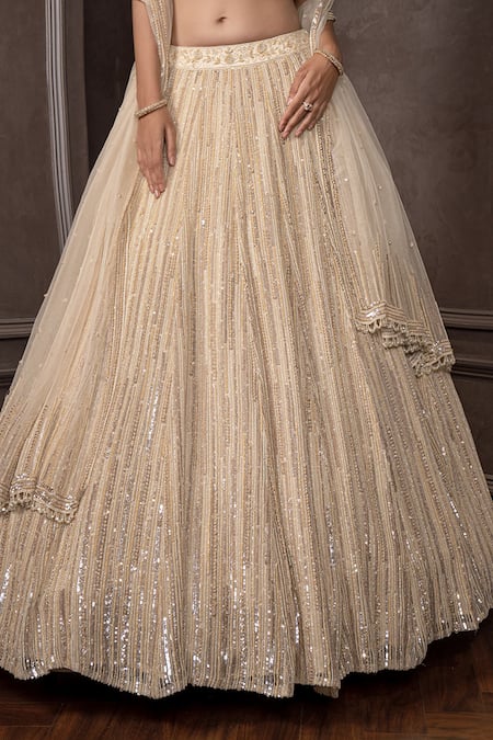 AMRIN KHAN Gold Organza, Net Sequins, Embroidery V-neck Lehenga Set at Aza Fashions AMRIN KHAN_Gold Organza, Net Sequins, Embroidery V-neck Lehenga Set _at_Aza_Fashions