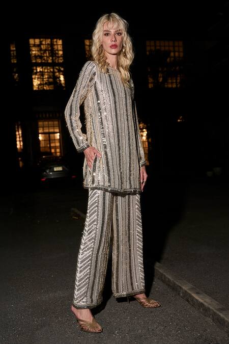 Dash And Dot Ivory Polyester Sequins, Embroidery, Metallic Thread Geometric Work Flared Pant Online at Aza Fashions Dash And Dot_Ivory Polyester Sequins, Embroidery, Metallic Thread Geometric Work Flared Pant _Online_at_Aza_Fashions