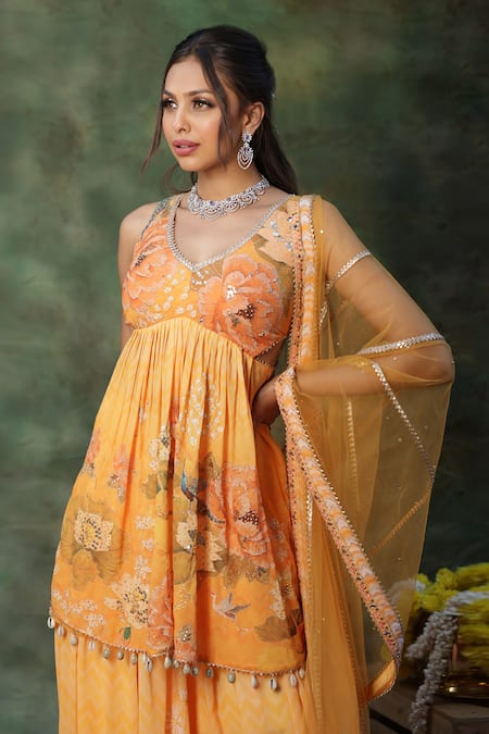 Archana Kochhar_Yellow Georgette, Net Sequins, Beads, Pearls V-neck Kurta Sharara Set _at_Aza_Fashions