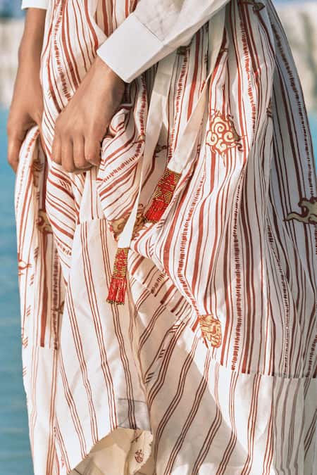 Shop Ahmev Red Cotton, Chanderi Beads, Tassels Htami Drawstring Panelled Skirt Online at Aza Fashions Shop_Ahmev_Red Cotton, Chanderi Beads, Tassels Htami Drawstring Panelled Skirt _Online_at_Aza_Fashions