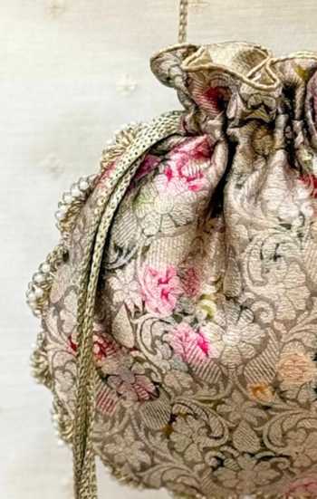AMYRA Pink Beads, Pearls, Crystals, Elora Brocade Pure Banarasi Silk Drawstring Potli Online at Aza Fashions AMYRA_Pink Beads, Pearls, Crystals, Elora Brocade Pure Banarasi Silk Drawstring Potli _Online_at_Aza_Fashions