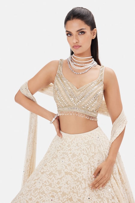 Buy_Basanti Kapde aur Koffee_Ivory Net Sequins, Beads, Stones Sweetheart Neck Nymph Lehenga Set _Online_at_Aza_Fashions