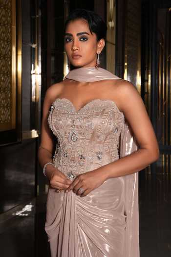 Shop_Nikunj By NIIDHI BAJAJ_Rose Gold Jersey Embroidery, Sequins, Beads, Sana Draped Skirt And Corset Set _Online_at_Aza_Fashions