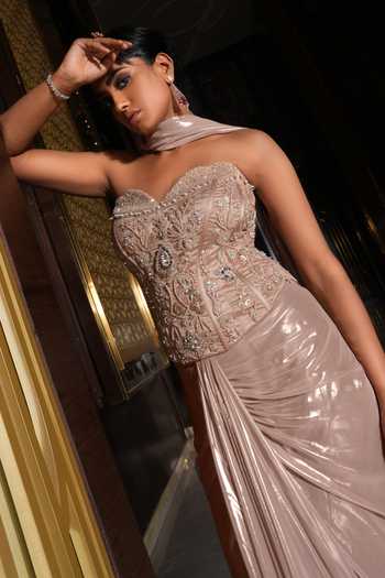 Nikunj By NIIDHI BAJAJ_Rose Gold Jersey Embroidery, Sequins, Beads, Sana Draped Skirt And Corset Set _at_Aza_Fashions