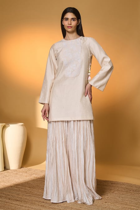 Masaba Ivory Silk, Organza Embroidery, Tassels, Lace Rose Blushing Kurta Sharara Set at Aza Fashions Masaba_Ivory Silk, Organza Embroidery, Tassels, Lace Rose Blushing Kurta Sharara Set _at_Aza_Fashions