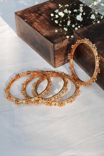 Buy Prestones Gold Plated Beads, Stones Ghungroo Embellished Bangles - Set Of 4 Online at Aza Fashions Buy_Prestones_Gold Plated Beads, Stones Ghungroo Embellished Bangles - Set Of 4 _Online_at_Aza_Fashions