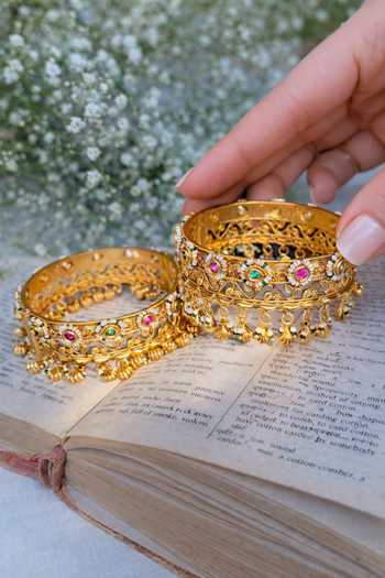 Prestones_Multi Color Beads, Stones Antique Temple Carved Bangles - Set Of 2 _Online_at_Aza_Fashions