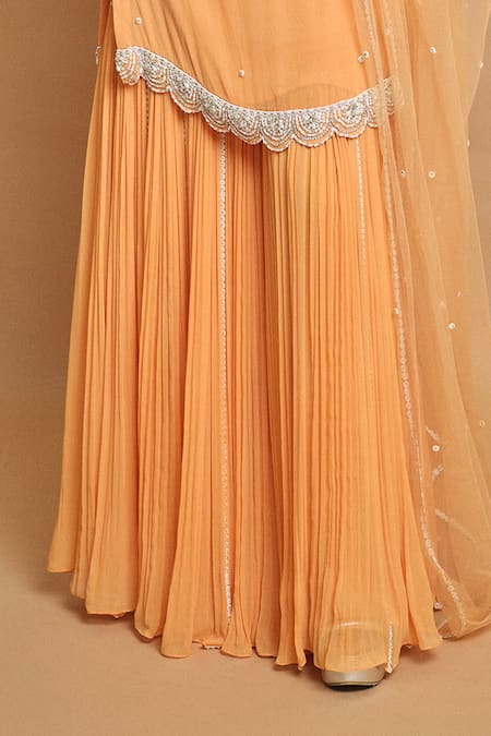 Surily G Peach Georgette, Net Pearls, Sequins Round Neck Kurta Set Online at Aza Fashions Surily G_Peach Georgette, Net Pearls, Sequins Round Neck Kurta Set _Online_at_Aza_Fashions