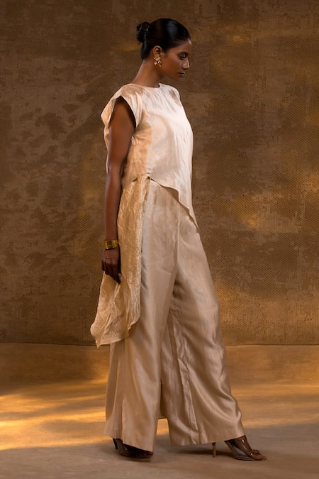 Eeda Ivory Silk, Tissue Asymmetric Top And Pant Set at Aza Fashions Eeda_Ivory Silk, Tissue Asymmetric Top And Pant Set _at_Aza_Fashions