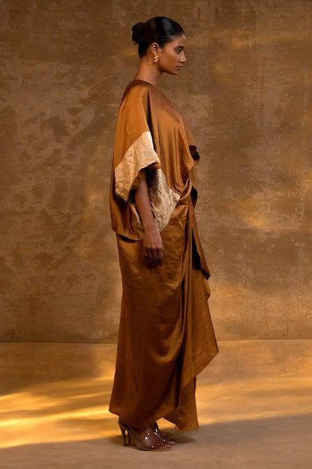 Shop Eeda Brown Silk, Tissue Zari Asymmetric Top And Draped Skirt Set Online at Aza Fashions Shop_Eeda_Brown Silk, Tissue Zari Asymmetric Top And Draped Skirt Set _Online_at_Aza_Fashions