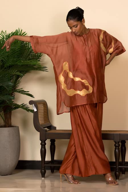 Eeda Orange Silk Applique Abstract Pattern Top And Pant Set at Aza Fashions Eeda_Orange Silk Applique Abstract Pattern Top And Pant Set _at_Aza_Fashions