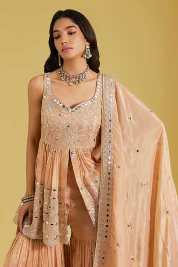 Shop Meenagurnam Peach Tissue Embroidery, Zari, Mirrors Flower Jaal Peplum Kurta And Gharara Set Online at Aza Fashions Shop_Meenagurnam_Peach Tissue Embroidery, Zari, Mirrors Flower Jaal Peplum Kurta And Gharara Set _Online_at_Aza_Fashions
