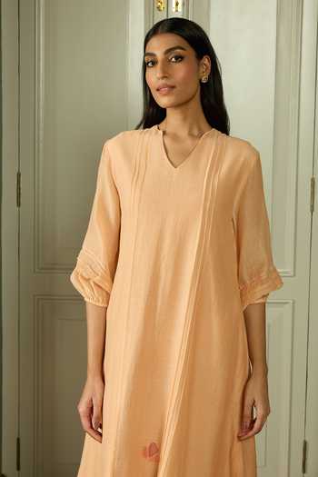 Vaayu Peach Cotton, Muslin Applique V-neck Pintuck Dress Online at Aza Fashions Vaayu_Peach Cotton, Muslin Applique V-neck Pintuck Dress _Online_at_Aza_Fashions