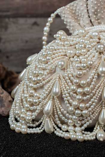 Buy_Nayaab By Sonia_Off White Pearls, Tassels Work Velvet Potli Bag _Online_at_Aza_Fashions