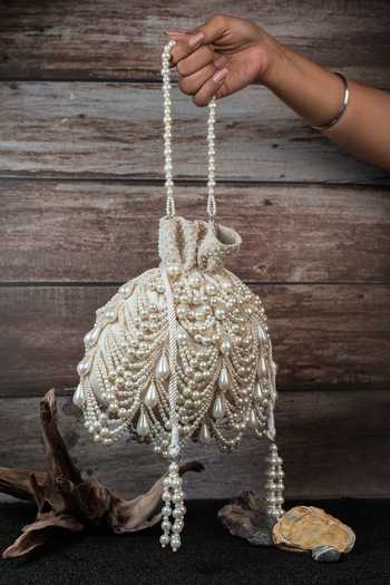 Shop_Nayaab By Sonia_Off White Pearls, Tassels Work Velvet Potli Bag _Online_at_Aza_Fashions