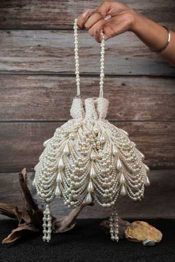 Nayaab By Sonia_Off White Pearls, Tassels Work Velvet Potli Bag _at_Aza_Fashions