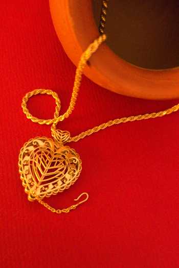 Manner_Gold Plated Cut Work Rakaan Long Heart Pendant Chain Necklace _at_Aza_Fashions