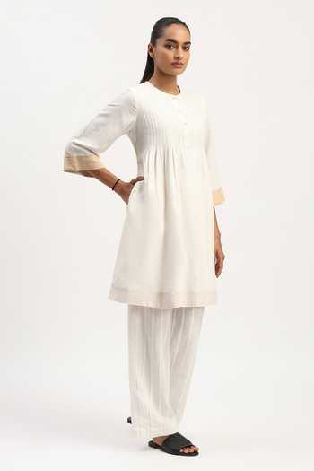 Buy_ABRAHAM AND THAKORE_Ivory Linen Round Neck Pleated Tunic _Online_at_Aza_Fashions