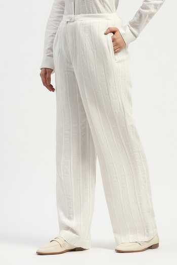 Shop_ABRAHAM AND THAKORE_Ivory Linen Pleated Trouser _Online_at_Aza_Fashions
