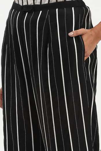 ABRAHAM AND THAKORE_Black Chanderi Embroidery Tape Stripe Trouser _at_Aza_Fashions
