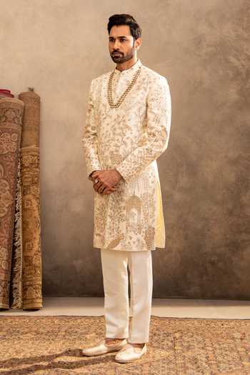 Millionaire_Cream Silk Embroidery, Zari Floral Raw Sherwani Set _at_Aza_Fashions
