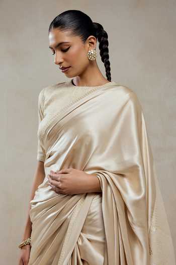 Nitika Gujral_Ivory Tissue, Shantoon Zari Round Neck Monga Saree And Blouse Set _at_Aza_Fashions