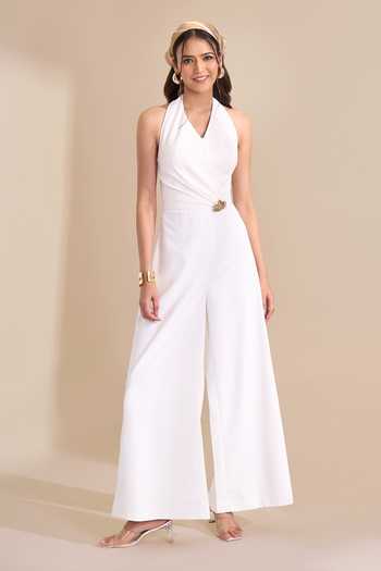 Naintara Bajaj_Ivory Halter Neck Wide Leg Jumpsuit _Online_at_Aza_Fashions