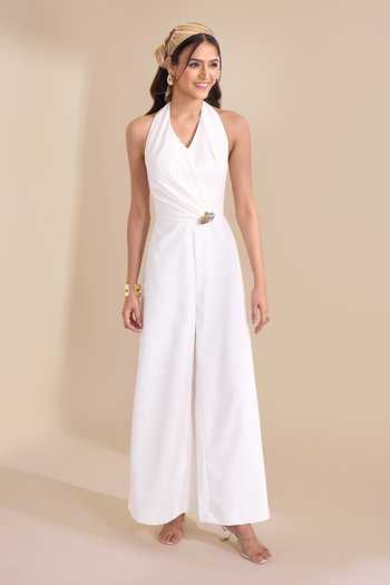Shop_Naintara Bajaj_Ivory Halter Neck Wide Leg Jumpsuit _Online_at_Aza_Fashions