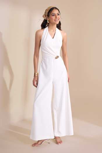 Naintara Bajaj_Ivory Halter Neck Wide Leg Jumpsuit _at_Aza_Fashions