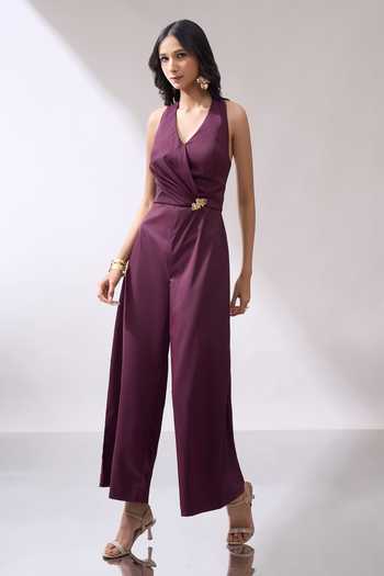 Naintara Bajaj_Wine Placed Brooch Halter Neck Jumpsuit _at_Aza_Fashions