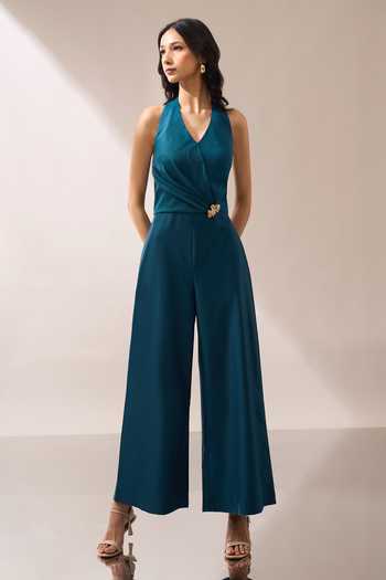 Naintara Bajaj_Teal Halter Neck Placed Brooch Jumpsuit _at_Aza_Fashions