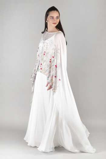 Mandira Wirk_Ivory Chiffon, Viscose Boat Neck Palm Sheer Cape And Gown _Online_at_Aza_Fashions