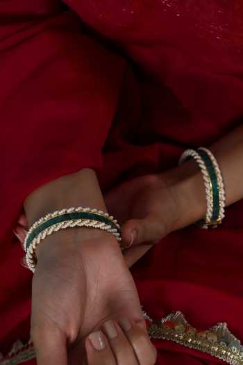Shop Shlok Jewels Green Stone Embellished Bangles - Set Of 2 at Aza Fashions Shop_Shlok Jewels_Green Stone Embellished Bangles - Set Of 2 _at_Aza_Fashions
