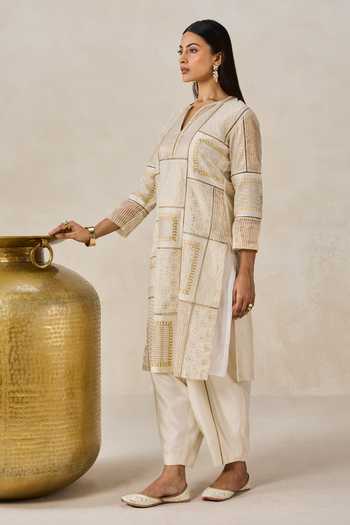 Buy Nitika Gujral Ivory Chanderi Split V-neck Gold Patch Work Kurta And Salwar Set Online at Aza Fashions Buy_Nitika Gujral_Ivory Chanderi Split V-neck Gold Patch Work Kurta And Salwar Set _Online_at_Aza_Fashions