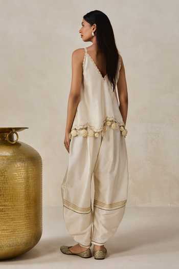 Shop Nitika Gujral Ivory Chanderi Halter Neck Applique Embroidered Top And Salwar Set at Aza Fashions Shop_Nitika Gujral_Ivory Chanderi Halter Neck Applique Embroidered Top And Salwar Set _at_Aza_Fashions