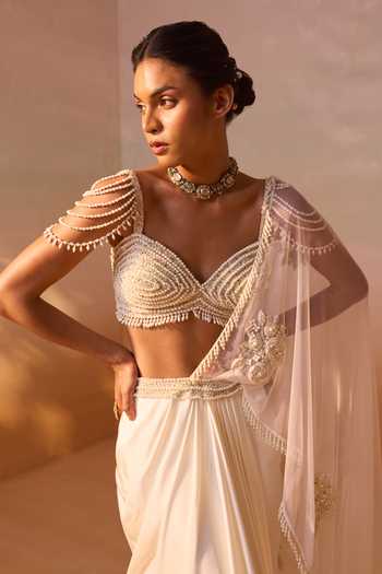 Nitika Gujral_Ivory Satin, Net Sweetheart Neck Pearl Work Pre-draped Saree With Bustier _Online_at_Aza_Fashions