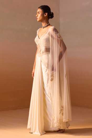 Nitika Gujral_Ivory Satin, Net Sweetheart Neck Pearl Work Pre-draped Saree With Bustier _at_Aza_Fashions