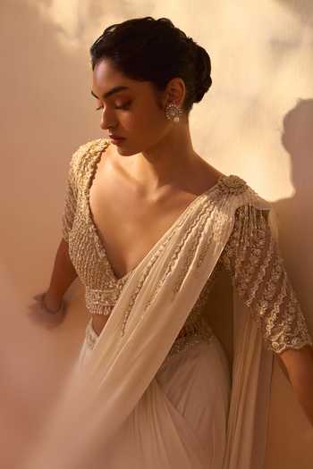 Nitika Gujral_Ivory Satin, Net V-neck Pre-draped Saree With Embroidered Blouse _at_Aza_Fashions