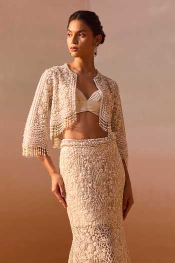 Shop Nitika Gujral Ivory Satin, Net Sweetheart Neck, Open Embellished Trail Skirt Set With Jacket Online at Aza Fashions Shop_Nitika Gujral_Ivory Satin, Net Sweetheart Neck, Open Embellished Trail Skirt Set With Jacket _Online_at_Aza_Fashions