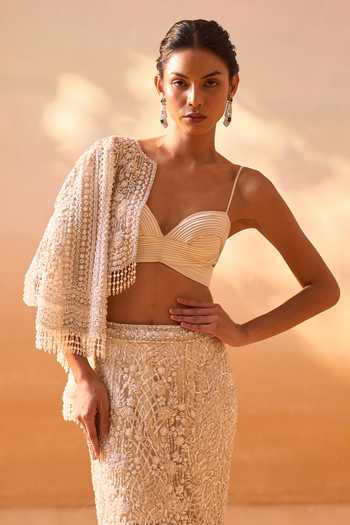 Nitika Gujral Ivory Satin, Net Sweetheart Neck, Open Embellished Trail Skirt Set With Jacket at Aza Fashions Nitika Gujral_Ivory Satin, Net Sweetheart Neck, Open Embellished Trail Skirt Set With Jacket _at_Aza_Fashions