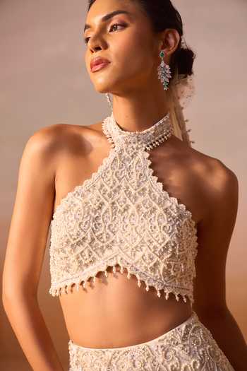 Nitika Gujral_Ivory Satin, Net Halter Neck, Choker Embellished Fishtailed Skirt With Blouse _at_Aza_Fashions