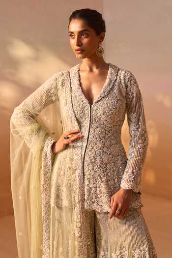 Nitika Gujral_Green Net V-neck, Yes Embroidered Peplum Kurta Sharara Set _at_Aza_Fashions