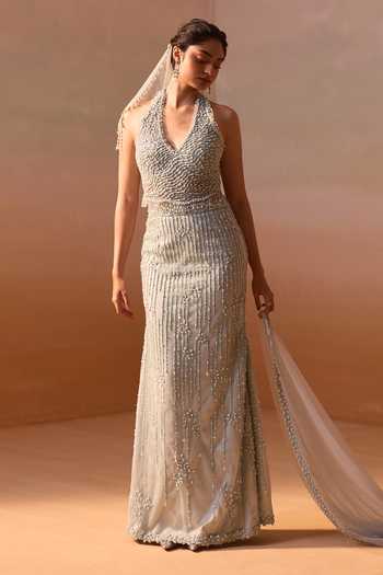 Nitika Gujral_Blue Satin, Net Pearls, Sequins, Crystals V-neck Embellished Corset Skirt Set _at_Aza_Fashions