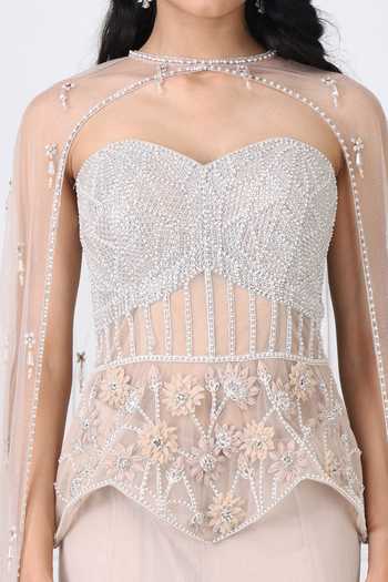 Isha Regalia_Beige Georgette, Net Crystals Embroidered Corset With Panelled Skirt Set _at_Aza_Fashions