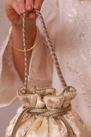 Shop_Amyra_Off White Sequins, Beads, Pearls, Tassels Suki Velvet Embroidered Potli _Online_at_Aza_Fashions