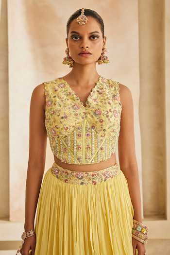 Shop Anu Pellakuru Yellow Silk, Chiffon Beads V-neck Kanak Embroidered Corset And Layered Lehenga Set Shop_Anu Pellakuru_Yellow Silk, Chiffon Beads V-neck Kanak Embroidered Corset And Layered Lehenga Set